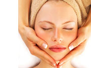 woman having facial massage therapy